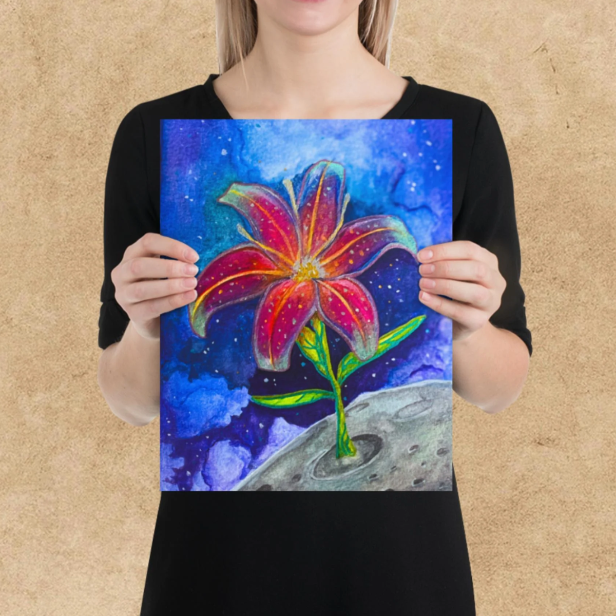 Person holding a colorful painting of a flower against a textured beige background